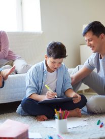 Portrait of friendly family spending leisure together at home